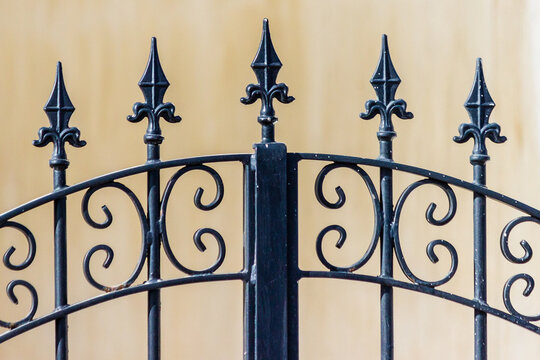 Elegant Decorative Wrought Iron Gate with Ornate Design Elements Closeup
