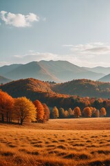 mountains in the distance with a field of grass and trees in the foreground