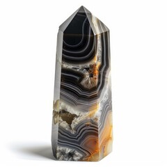 Fototapeta premium Botswana agate point showing concentric banding and drusy center