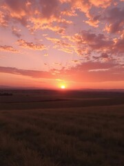 Obraz premium Fiery orange and purple hues paint the sky as the sun dips below the horizon, casting long shadows across a tranquil landscape, beautiful