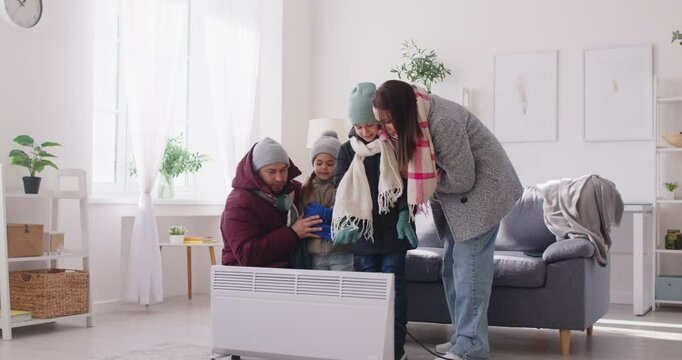 Unhappy at home, badly frozen in freezing cooled flat wearing warm coat, shivering tremble with cold, feels bad, suffer of heating system problem, climate, temperature regulation, no central heating