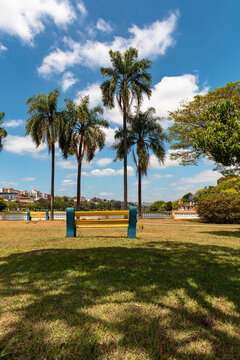 View of the famous Tabo&atilde;o lake with bench on a sunny day in the Brazilian summer, in the city of Bragan&ccedil;a Paulista, Brazil, a well-known tourist city in the interior of S&atilde;o Paulo