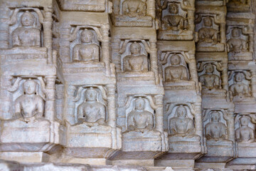 India. Rajasthan state. Ranakpur. Chaumukha Temple, also called the Ranakpur Temple dedicated to Lord Adinatha. Bas relief sculpture of Tirthankara