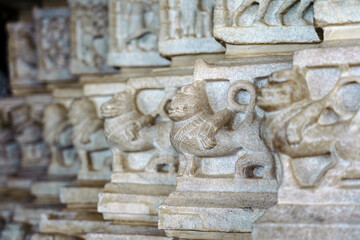 India. Rajasthan state. Ranakpur. Chaumukha Temple, also called the Ranakpur Temple dedicated to Lord Adinatha. Bas relief sculpture of dragons