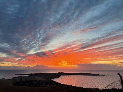 Fiery Sunset Over the Mediterranean Coastline of Cavo Greco, Ayia Napa, Cyprus, Featuring Vibrant Skies and Tranquil Waters
