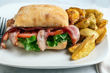 ciabatta blt sandwiches with potato wedges,