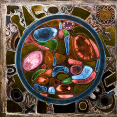 Psychedelic mandala, abstract geometric circle with shapes. The dabbing technique near the edges gives a soft focus effect due to the altered surface roughness of the paper.