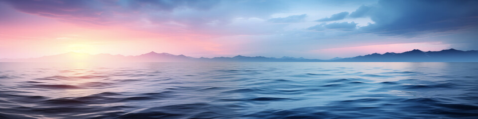 Obraz premium Beautiful ocean with a sunset in the background