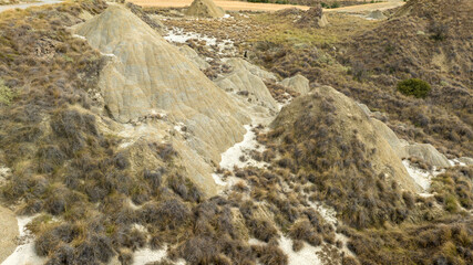 Aerial view of the Calanchi near Pisticci, in the province of Matera, Basilicata, Italy. Calanchi are badlands, a type of dry terrain where sedimentary rocks and clay-rich soils have been eroded away.