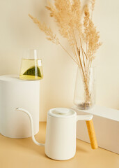 tea bags brewed in a glass, in a beautiful minimalist composition on a beige background