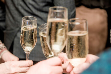 Glass glasses of champagne, people celebrating an important event, festive toast