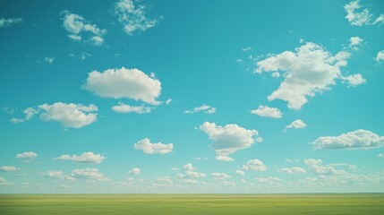 Vast Sky with Fluffy Clouds and Green Field