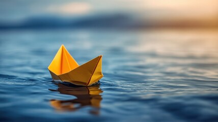 Yellow paper boat floating on ocean water tranquil seascape nature photography serene viewpoint minimalist concept