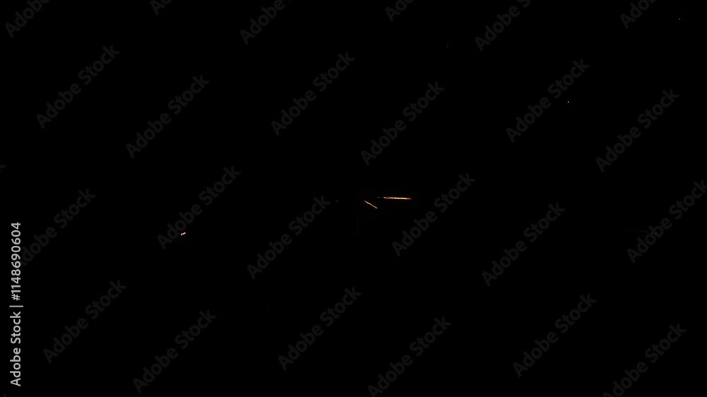 Aufkleber Vibrant display of sparks and light radiates outward in dynamic explosion effect at night