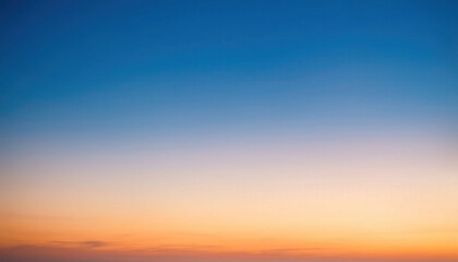 Fototapeta premium A gradient sky background transitioning from pale orange to soft blue, evoking a calm and atmospheric mood, perfect for serene, peaceful, and tranquil designs.