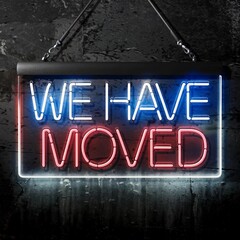 Illuminated "We Have Moved" Neon Sign