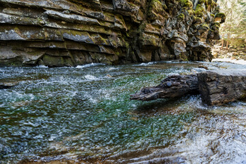 Tranquil River Scene with Rocky Outcrops and Flowing Water