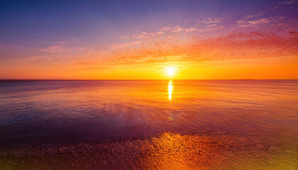Fototapeta premium A radiant sunrise gradient featuring harmonious blends of orange, yellow, and pink hues, creating a vibrant and uplifting atmosphere perfect for backgrounds or designs. 