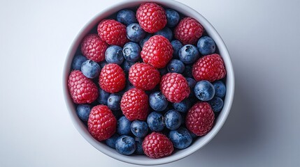 Fresh raspberries and blueberries in a bowl. (13)