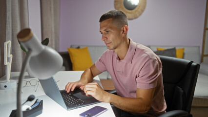 Young man working on a laptop in a cozy living room, showcasing a modern interior with a soft,...