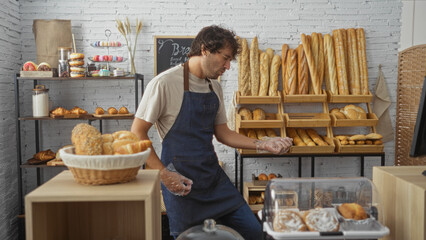 Hispanic young man making a guitar gesture in a bakery shop full of bread and pastries, showcasing...
