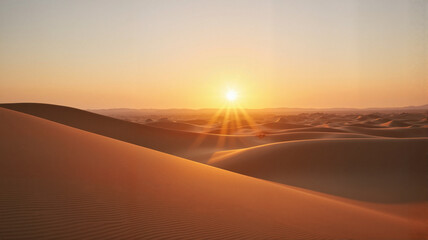 Golden sunset over desert sand dunes	