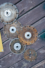 wooden door with used diamond saw discs