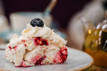 Beautiful delicious cake decorated with blueberries in a cafe - close-up
