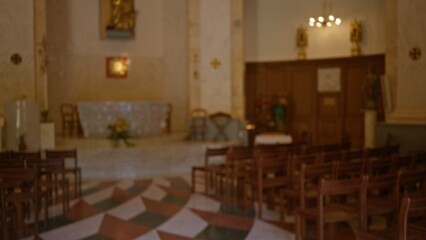 Blurred interior of a christian church with empty wooden chairs and altar, capturing a peaceful religious atmosphere indoors with a defocused and bokeh effect.