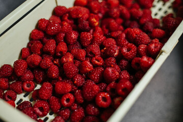 Preparation of raspberries for making jam, compote. Close-up