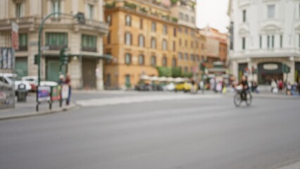 Obraz premium Blurred street scene in rome, italy, showcasing defocused architecture and bustling urban life on an old town street with people in the background.