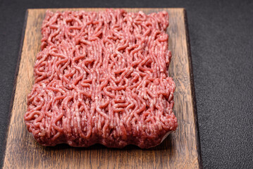 Fresh raw ground minced beef with salt and spices