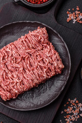 Fresh raw ground minced beef with salt and spices
