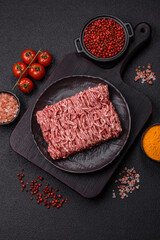 Fresh raw ground minced beef with salt and spices