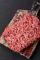 Fresh raw ground minced beef with salt and spices
