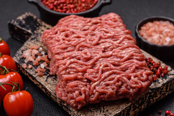Fresh raw ground minced beef with salt and spices