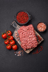 Fresh raw ground minced beef with salt and spices