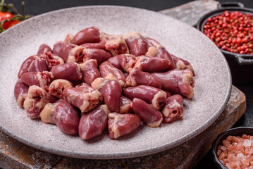 Raw chicken hearts with salt, spices and herbs