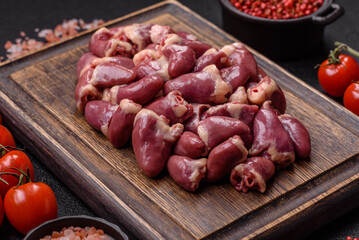 Raw chicken hearts with salt, spices and herbs