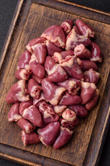 Raw chicken hearts with salt, spices and herbs