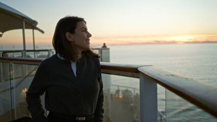 Woman enjoying the sunset on a cruise ship docked outdoors, capturing a serene moment with the...