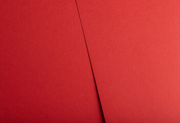 Crimson red paper texture with a matte, tactile surface and vibrant warm tones. The minimalist...