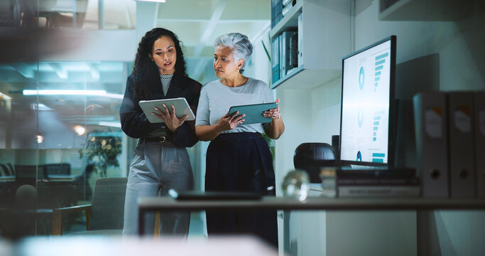 Office, business women and tablet for online research, internet search and website graphs. Mature, professional and corporate people on tech for project management, reading email and planning at desk - Powered by Adobe