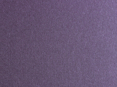 Deep purple paper texture with a metallic amethyst finish and satin sheen. The rich lavender tones and glossy surface create a sleek, elegant design, perfect for luxury stationery,