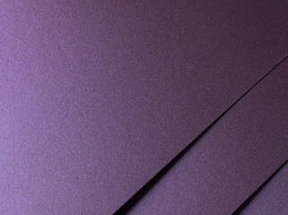 Deep purple paper texture with a pearlescent metallic finish, featuring sleek lines and a glowing...