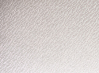 Pearlescent off-white paper texture with a glossy sheen and subtle wavy gradient. The creamy ivory tones shimmer with elegance, creating a sleek and luxurious surface ideal for