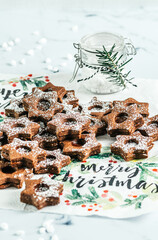 Traditional Linz Christmas cookies filled with quince jam on a white background