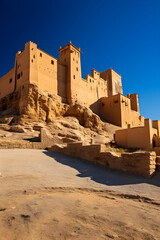 The Impressive Fortress: An Awe-inspiring View of a Timeless Citadel against a Blue Sky