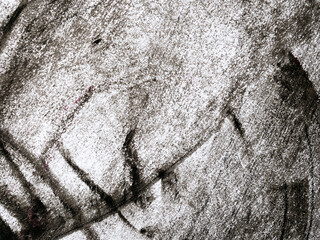 drawing paper scribbled with black and white crayon