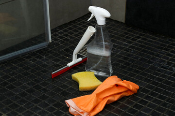 Bathroom cleaning equipment with shower wiper, spray bottle, gloves and a sponge 